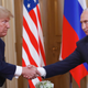 President Donald Trump and Vladimir Putin shake hands at the Presidential Palace in Helsinki, Finland on July 16, 2018